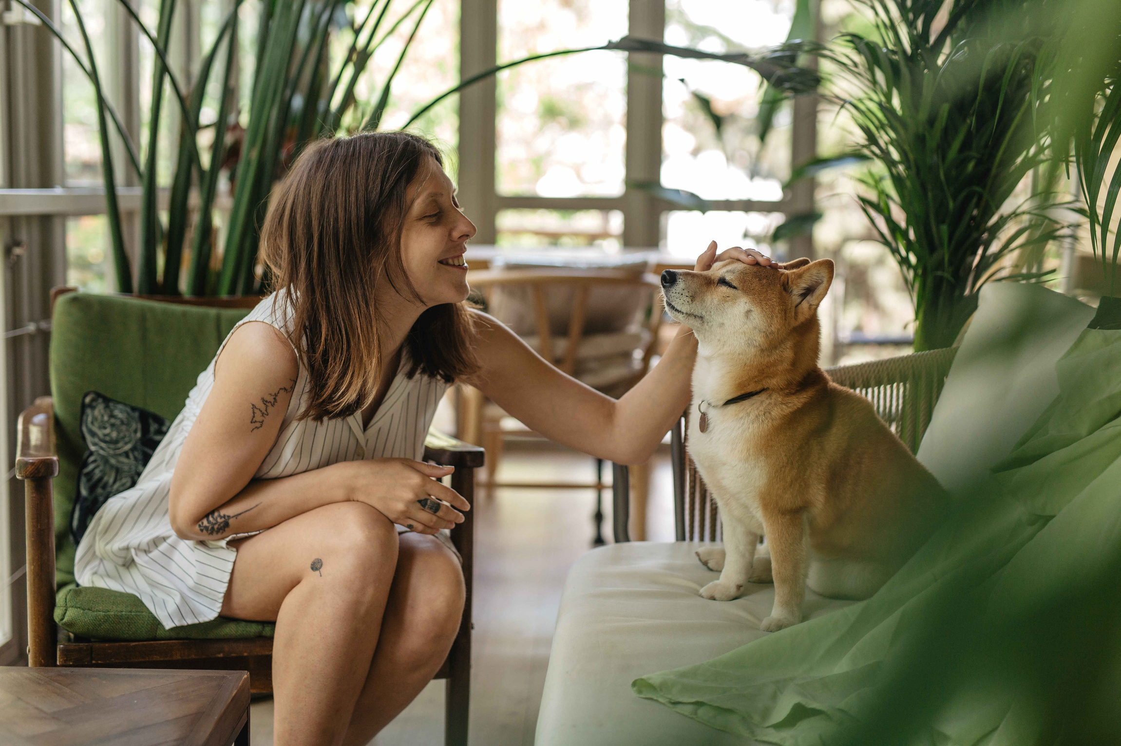 Happy Woman Petting Her Dog
